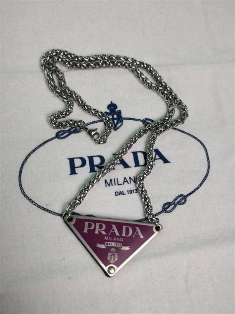 fake prada chain|real prada triangle logo.